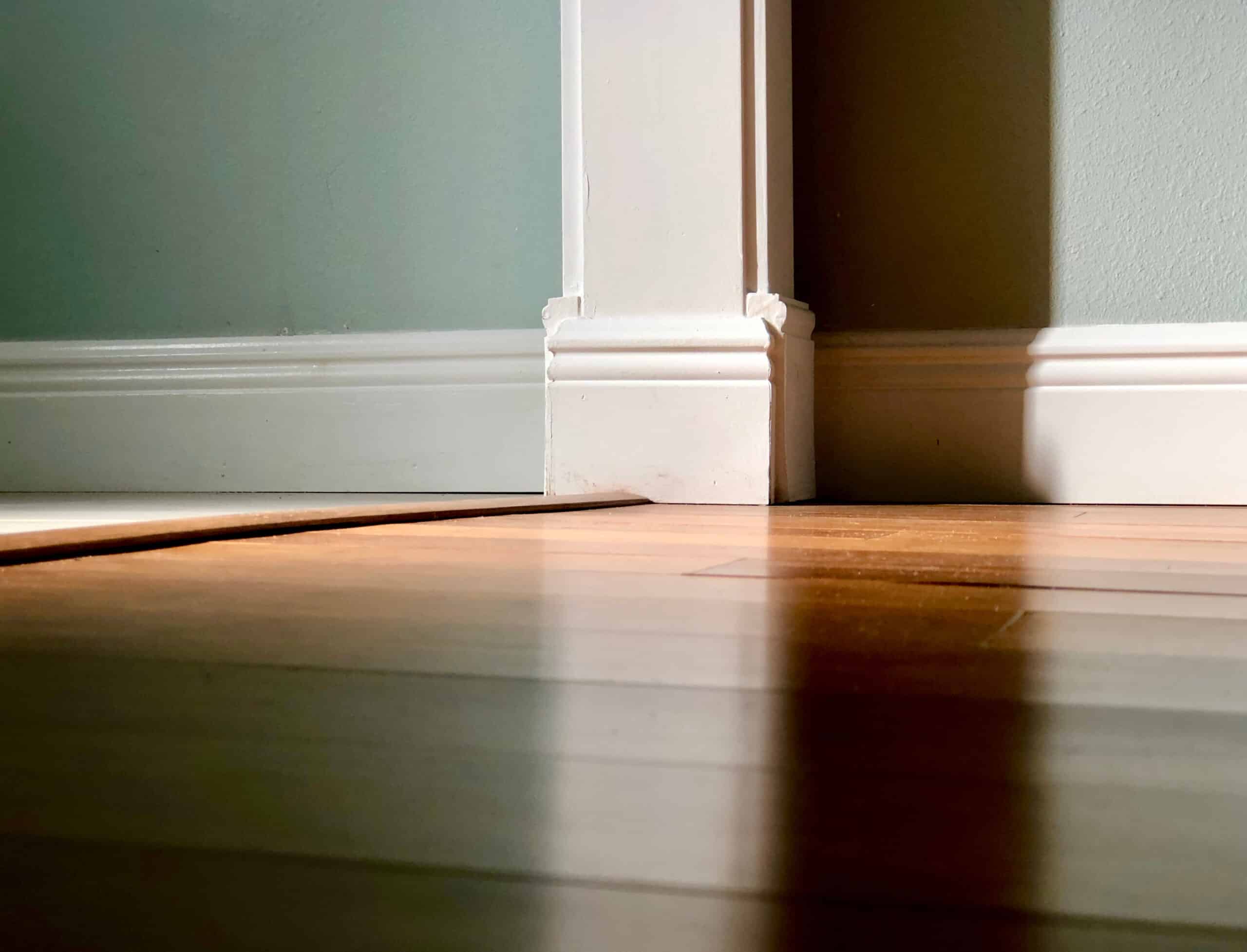 Closeup,Low,Angle,View,Of,Home,Interior,Transition,From,Hardwood